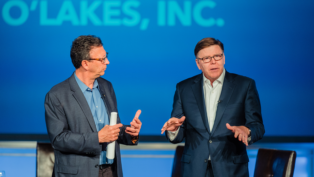 Frank Sesno and Chris Policinski talk on stage at the 2018 Planet Forward Summit before the &quot;What&#039;s Your Sustainability Story?&quot; panel. (Photos by Adam Mason for PlanetForward.org)